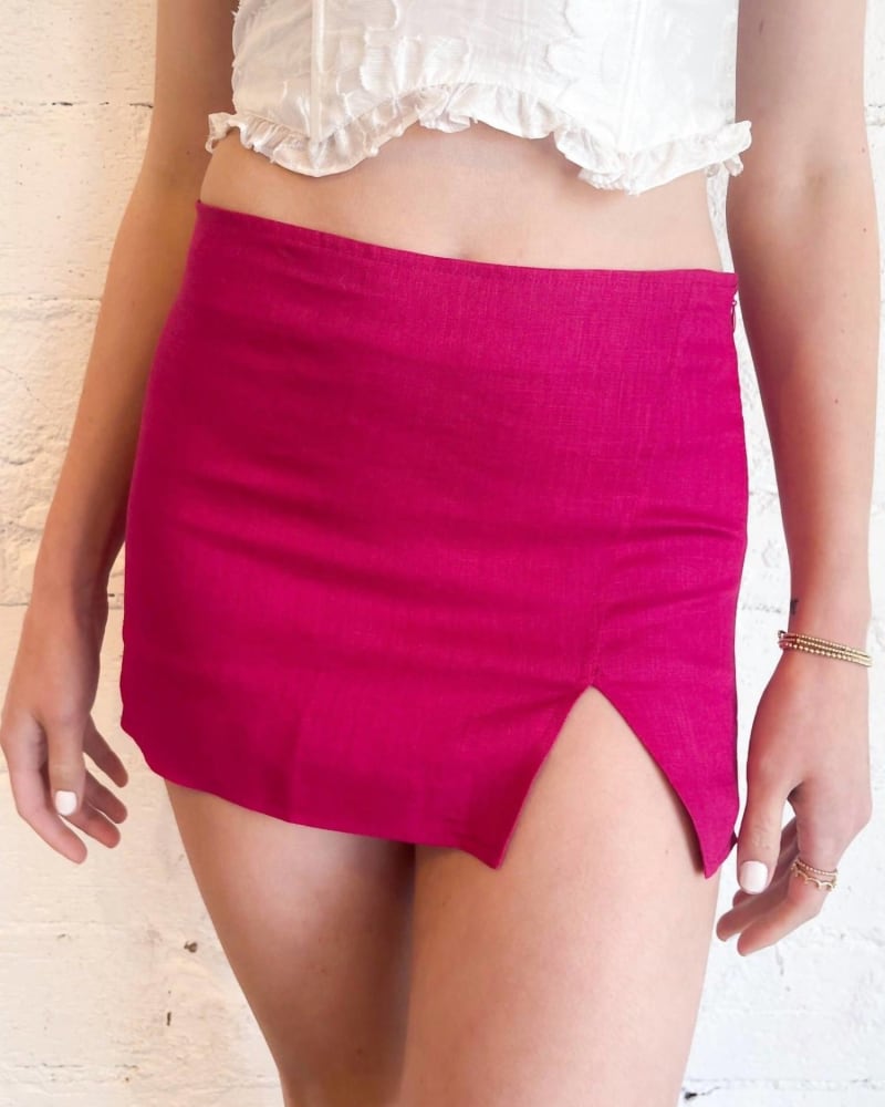 Front of a model wearing a size Large Posh Mini Skirt In Pink in Pink by OLIVACEOUS. | dia_product_style_image_id:359109